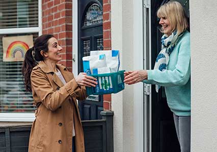 Carer collecting medication