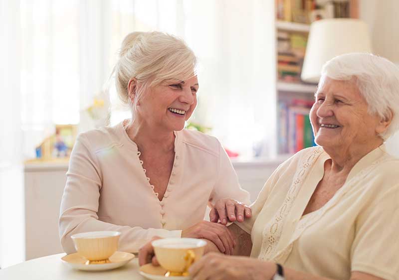 carer and client laughing while making memories