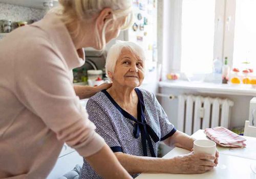 home carer and client talking